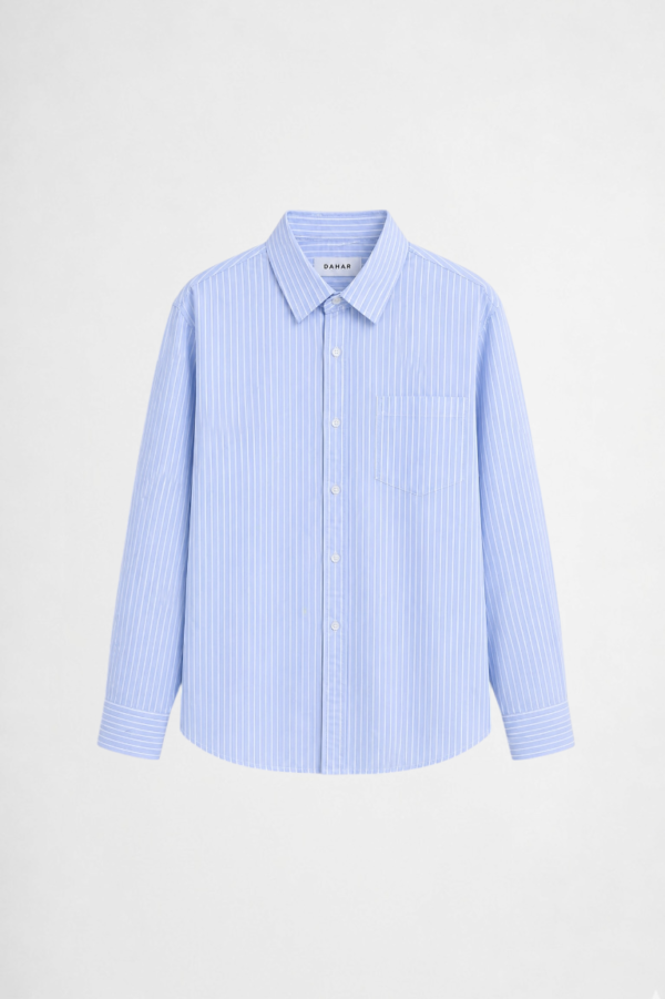 Light blue cotton-linen blend shirt with oversized fit and breathable minimalist styling by DAHAR.
