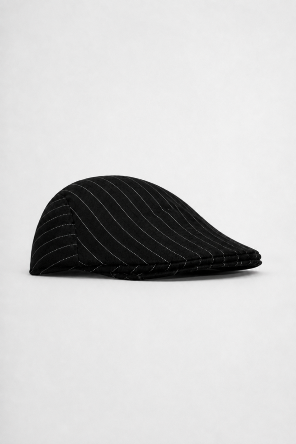 Black pinstripe ivy cap made from soft cotton blend.