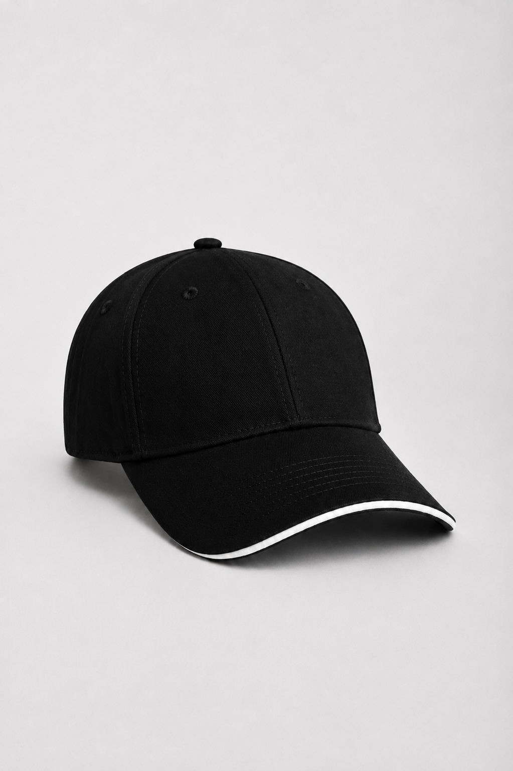 Black cotton baseball cap with adjustable buckle closure by DAHAR.